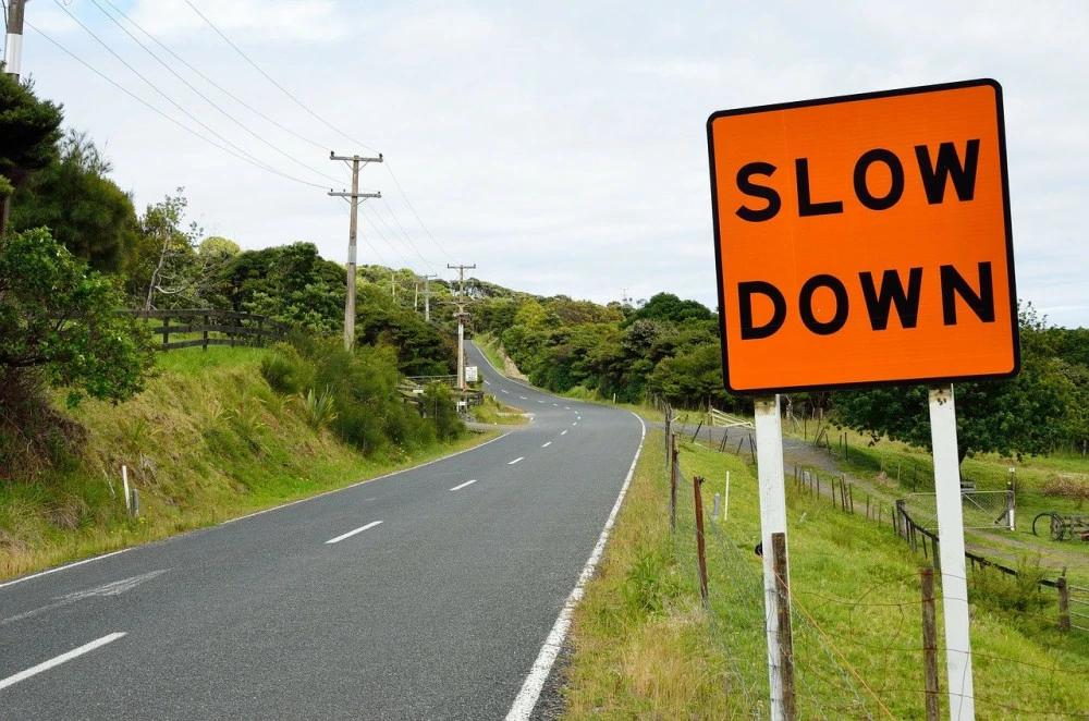 Slow down sign